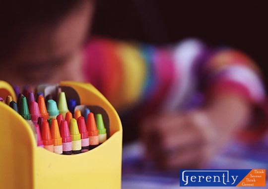 child using crayons